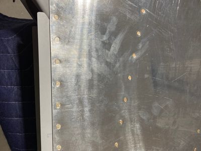 The skin is a bit wavy around the AN426AD4 rivets.