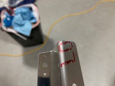 The tiny mark on the part.