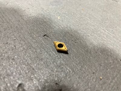 Worn carbide insert.