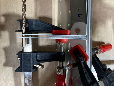 Clamping the seat belt anchors.
