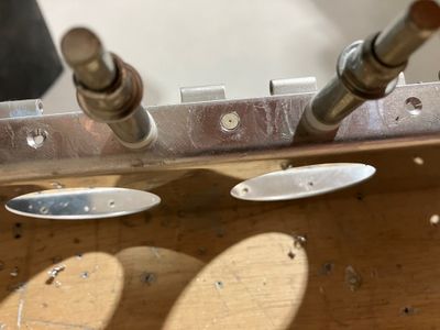 Countersunk holes.