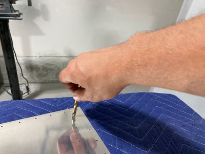 Deburring with the drill bit.