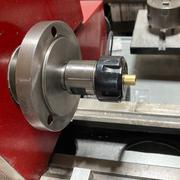 Machining the bushing in the lathe.