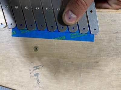 Marking the tape for the holes.
