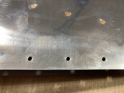 The oblong holes.