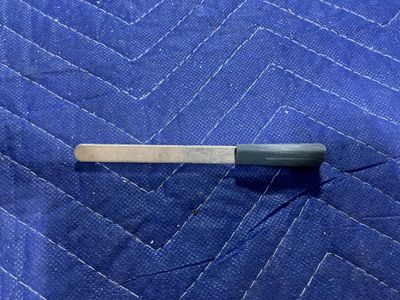Popsicle stick wrapped in a 320 grit sandpaper.