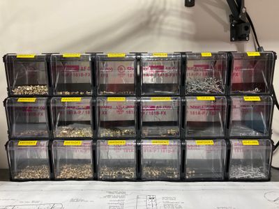 The rivet storage boxes.