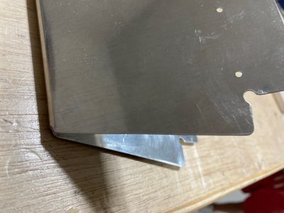 Rounding the edges of the trim tab.