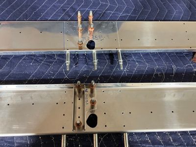 Filed holes for the aileron pushrods