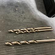 The broken drill bits.