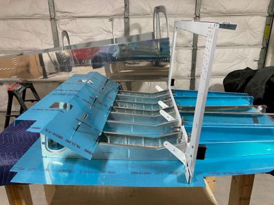 Drilling the crotch strap brackets and clecoed the center section