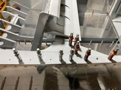The left F-757 plate is drilled to the fuselage.