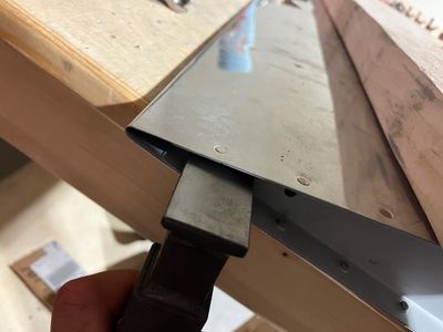 Riveting the aftmost rivet.