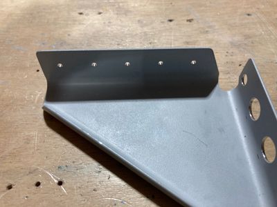 The fuselage gussets F-7114 are drilled.