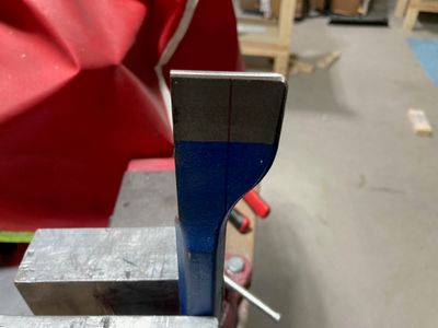 Removed one half of the chisel.