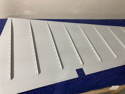 The stiffeners are riveted to the left side skin.