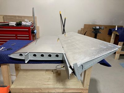 The rudder temporarily hanging on the vertical stabilizer.