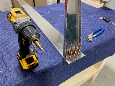 Upsizing the hole for the bolt.